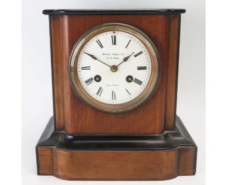 An Edwardian mahogany and ebony cased mantel clock, of rectangular outline, with 9.5cm Roman dial, the circular movement stri