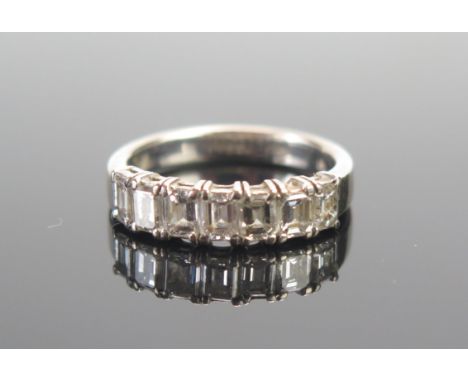 An 18ct White Gold and Baguette Cut Diamond Half Eternity Ring, c. 3.9x3.1mm stones, size M.25, stamped 750, 5.53g 