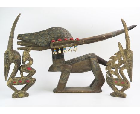 A Bamana Chi Wara horizontal headdress, carved in the form of an antelope, with applied copper and metal panels, 70cm long to
