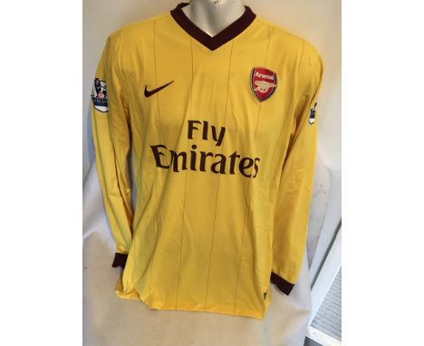 Arsenal 2010/2011 Match Worn Football Shirt: Long sleeve yellow shirt. Premiership badging to arms. Number 6 Koscielny to rea