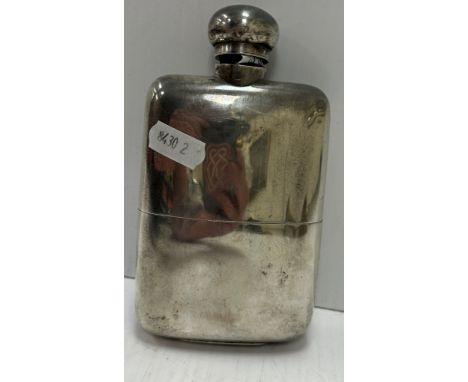 An Edwardian silver hip flask (by Goldsmiths &amp; Silversmiths Company Ltd, London 1906), 8.2 oz