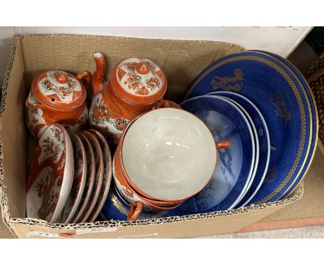 Two Wedgwood powder blue and gilt decorated plates with Chinese temple lion decoration manufactured for James Powell &amp; So