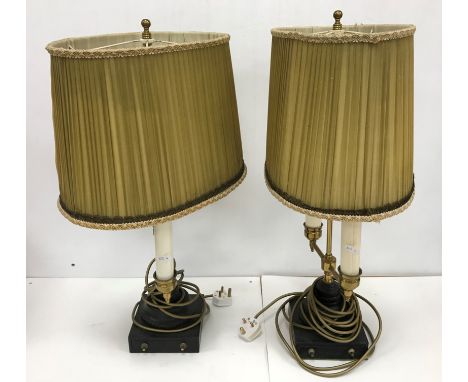 A pair of brass and black painted iron based twin light table lamps in the Victorian style, total height including finial 59 
