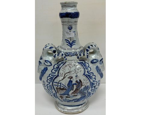 A 19th Century Continental faience glazed pottery flask, the narrow neck decorated with peacock feathers, the main body decor