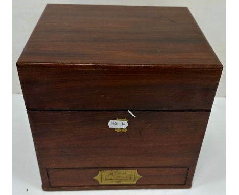 A 19th Century mahogany apothecary's chest containing eleven various bottles, small measuring flask, treen ware measuring gob