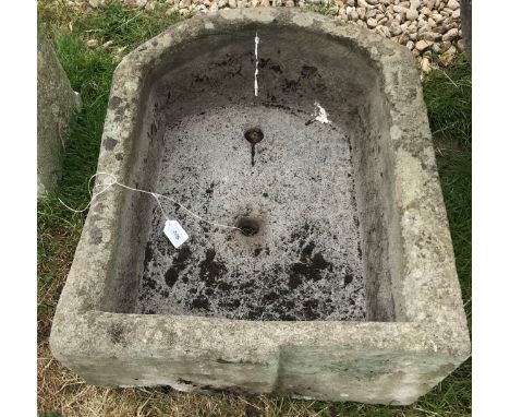 A natural stone D shaped trough, 68 cm wide x 51 cm deep x 22 cm high