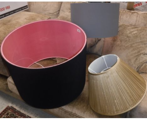 A large black corrugated lampshade with pink inner 55 cm diameter x 40 cm high together with a plain grey cylindrical lampsha