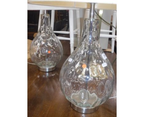 A pair of modern clear glass baluster table lamps with dimple style decoration together with circular shades, height excludin