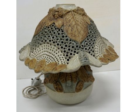 A Studio Pottery glazed flower head or fungus table lamp with foliate and insect decoration bearing incised initials "BR" to 