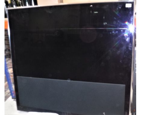 A Bang and Olufsen wall mounted television with integral speaker (type 9566) 113.5 cm wide x 103.5 cm high together with iron