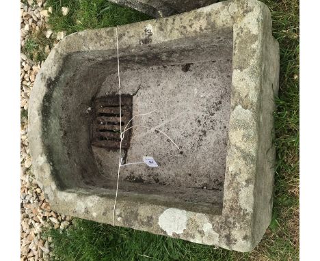 A natural stone D shaped trough, 59 cm wide x 42.5 cm deep x 21 cm high