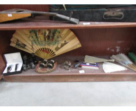 A mixed lot including fans, opera glasses, silver napkin ring, radiotone harmonica etc