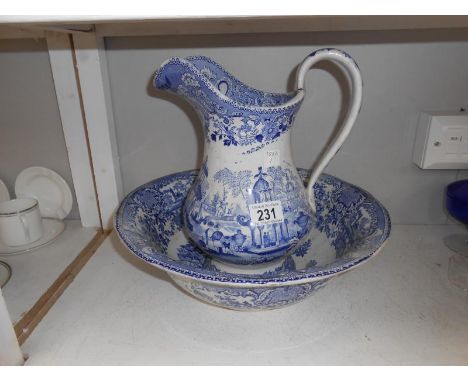 A 19th century blue and white jug and basin set, a/f (top of handle)
