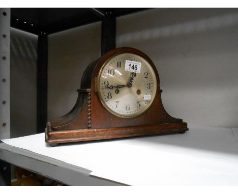 An oak mantel clock
