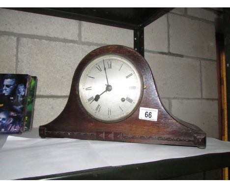 A mantel clock with key and pendulum