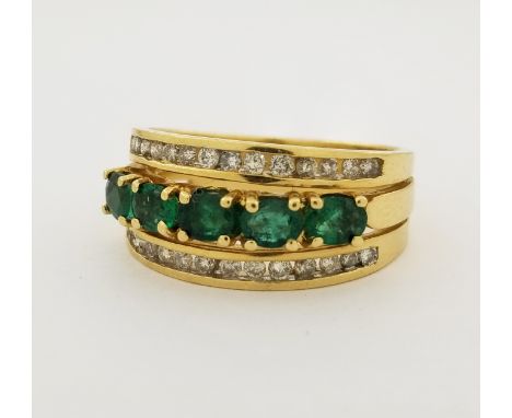 14K NISSKO Emerald & Diamond Ring. Ring set with 5 oval cut emeralds between rows of 14 round cut diamonds. Stamped inside ba