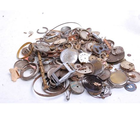 A collection of assorted wrist and pocket watch parts, to include dials, springs, case backs, part movements etc 