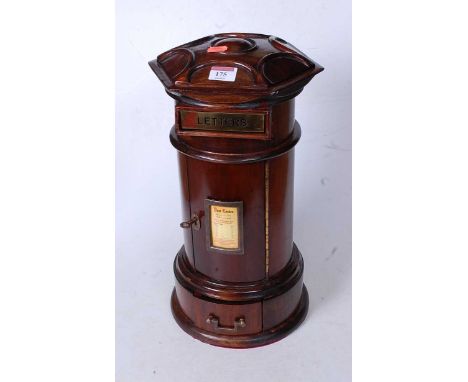 A Victorian style mahogany novelty post-box, having an hexagonal top above a brass letterbox, the cylindrical body enclosed b