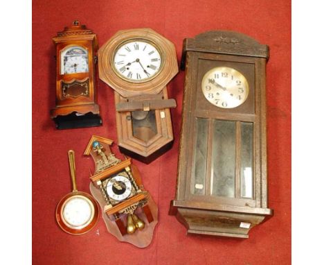 A 1930s oak cased wall clock; together with a droptrunk wall clock; and two others (4)