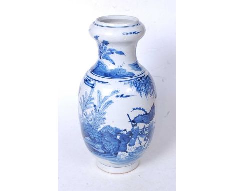 A Chinese export blue and white vase, having an onion top to a baluster body, underglaze blue decorated with various figures 