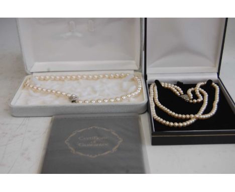 A Pompadour faux pearl two string choker with marcasite set clasp, boxed, together with one other faux pearl single string ch