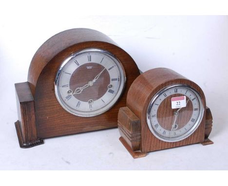 A 1950s oak cased mantel clock, having a silvered dial with Roman numerals and 30-hour movement, h.16cm; together with a Smit