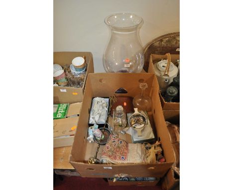 A large glass storm light on ceramic base together with a pewter quaiche, two decanters and stoppers, pated sifting spoon etc