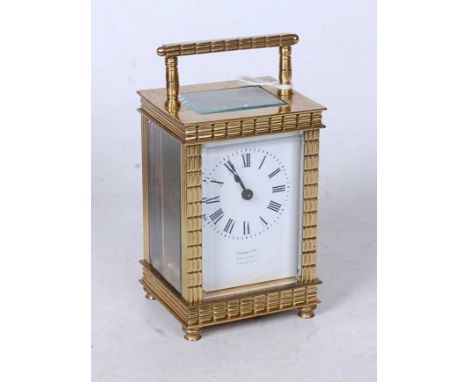 An early 20th century French lacquered brass cased carriage clock, with single train movement and platform escapement, the en