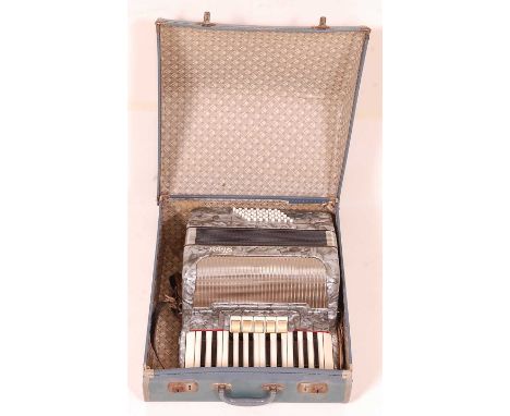 A German Alvari faux mother of pearl cased piano accordion no. K1217, in fitted leather case.