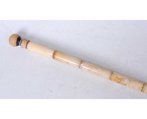 A faux ivory walking stick, each section carved with a female figure, having a turned wooden handle, length 87cm