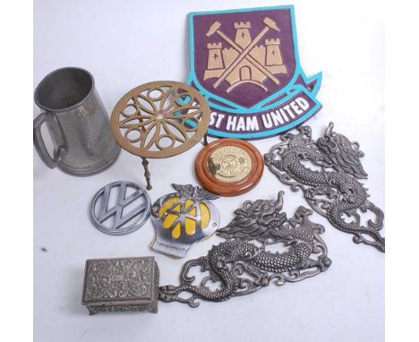 A collection of miscellaneous items to include a brass trivet, pewter tankard, pressed metal dragon, compass etc