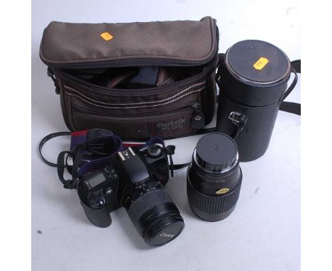 A Canon EOS 500N camera in Optex camera bag together with a Japanese Auto Makinon lens in case