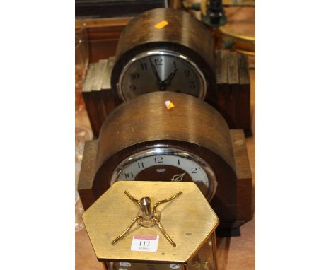 A Kundo brass cased anniversary type clock having a circular dial with raised Roman markers, height 25cm, together with two 1