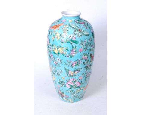 A Chinese export Meiping vase, on a turquoise ground enamel decorated with butterflies and flowers, having red seal mark vers