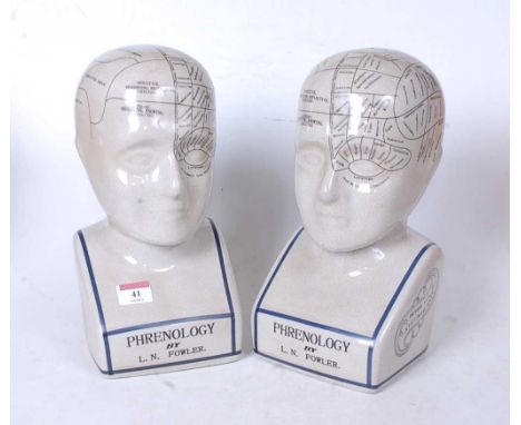 A pair of reproduction glazed ceramic phrenology busts, h.29cm 