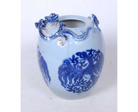 A Chinese vase, of ovoid form, on a blue ground, the rim relief decorated with kylin and prey, the body further underglaze bl