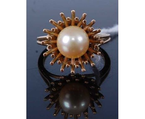 A modern yellow metal and cultured pearl set dress ring, unmarked but tests as 9ct, 6.1g, size N 