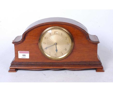 A 1920s mahogany cased mantel clock, having engine turned dial with Arabic numerals and French cylinder movement, w.27cm