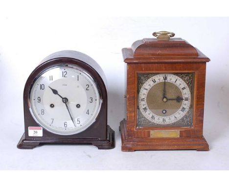 A mid-20th century walnut cased mantel clock, in the 18th century style, having a silvered dial with Roman numerals and gilt 