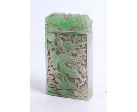 A faux jade pendant, carved as a dragon chasing a pearl, 9 x 5cm
