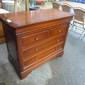A C20th mahogany side cabinet with panel doors above drawers on squat feet