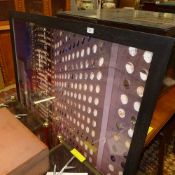 A photographic print of modern buildings framed and glazed