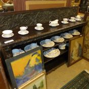 A Victorian profusely carved oak open bookcase