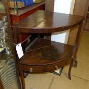 A Georgian oak corner washstand with two tiers on splayed supports
