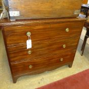 A Georgian mahogany chest of three graduated drawers raised on shaped bracket supports with brass