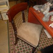 A near pair of William IV mahogany bar back chairs with wrapper seats on reeded supports