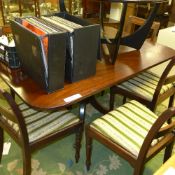 A Regency mahogany breakfast table the tilt top raised on quadruped base