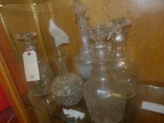 A collection of glass decanters and stoppers including a pair