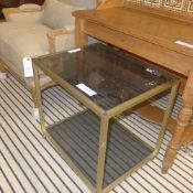 An Italian designer glass two tier side table