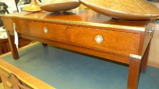 A campaign design mahogany and brass low table with three drawers on square section supports